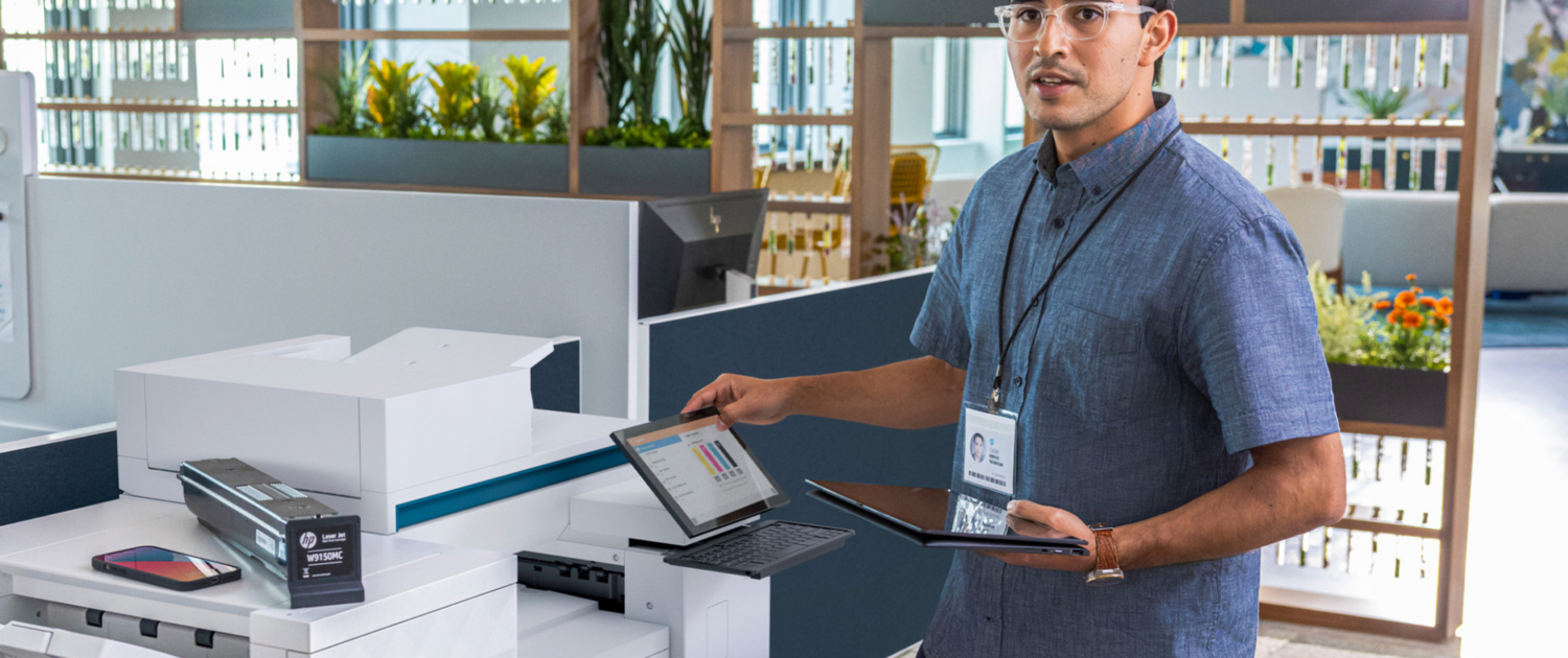 Man Repairing Hp Printer In Modern Office