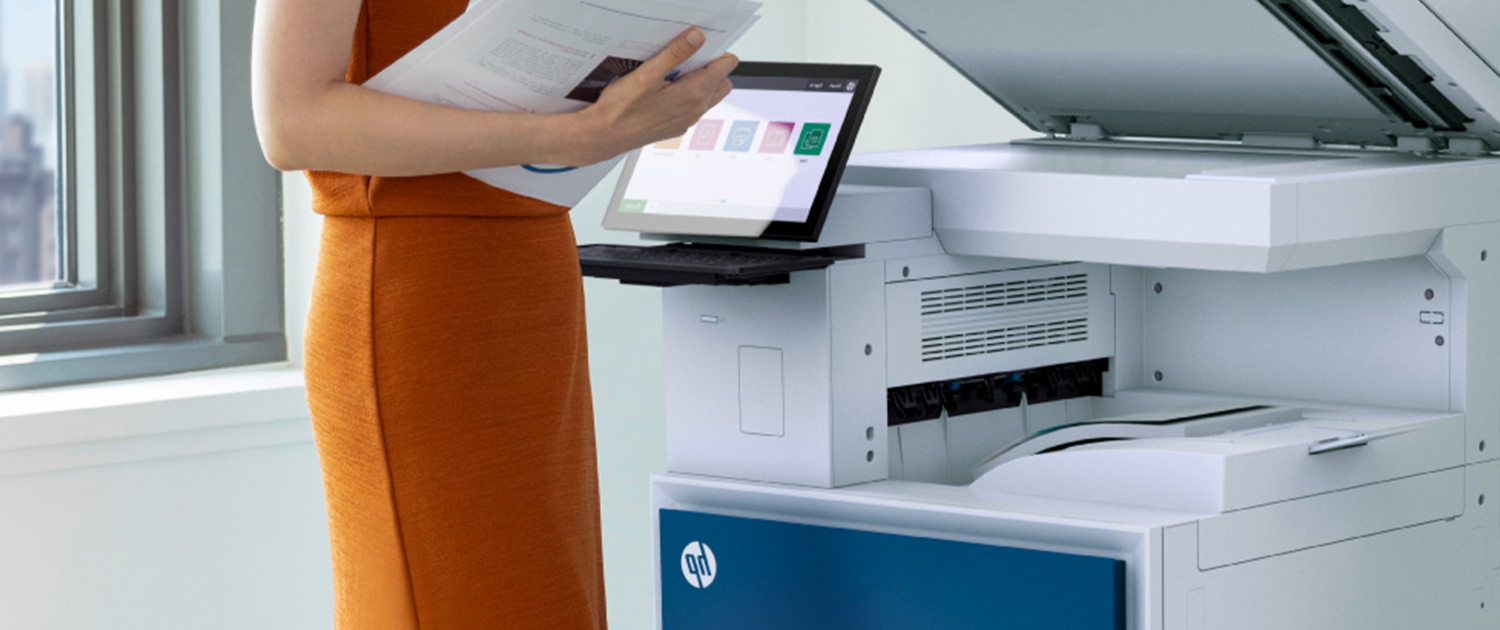 Woman In Orange Dress Printing On Hp Printer