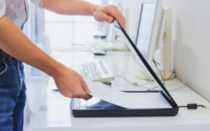 Closeup Of Hands Scanning Documents