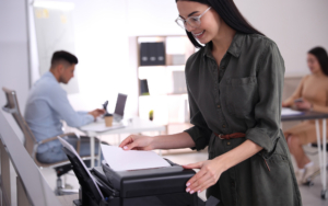 Employee Using New Modern Printer In Office