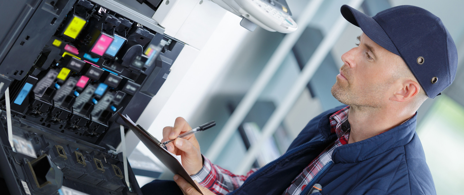 Handyman Fixing The Office Printer