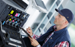 Handyman Fixing The Office Printer