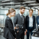 Group Of Business People Hanging Out Together Near The Copier