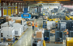People Walking Through Warehouse Industrial Floor
